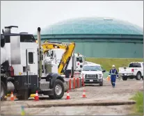  ?? CP PHOTO ?? A worker walks past heavy equipment as work continues at Kinder Morgan’s facility in preparatio­n for the expansion of the Trans Mountain Pipeline, in Burnaby, B.C., on Monday.