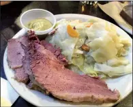  ?? Arkansas Democrat-Gazette/ERIC E. HARRISON ?? Even at an Irish pub such as Dugan’s, you can’t get a dish much more Irish than corned beef and cabbage.