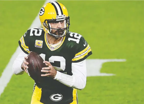  ?? STACY REVERE/ GETTY IMAGES ?? “Not playing with anybody in the stands makes a big difference,” says Packers QB Aaron Rodgers, who has weaponized his voice to fool aggressive defences.