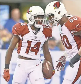  ?? AARON DOSTER/USA TODAY SPORTS ?? Cardinals wide receiver J.J. Nelson (14) is met by tight end Ifeanyi Momah after scoring a touchdown against the Indianapol­is Colts in the second half Sunday at Lucas Oil Stadium.