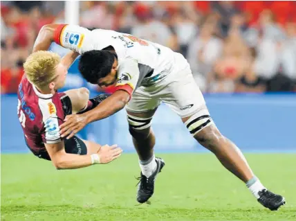  ?? Photo / Photosport ?? Chiefs hitman Samipeni Finau smashes the Reds’ Tom Lynagh in a marginal tackle.