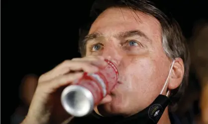  ?? Photograph: Adriano Machado/Reuters ?? Jair Bolsonaro’s penchant for sugar-laden condensed milk has come under scrutiny amid a Covid catastroph­e in the Amazon. But that doesn’t mean he drank the whole government supply.