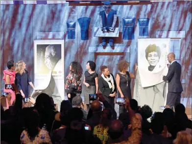  ?? The Canadian Press ?? Canada Post stamps honouring iconic black Canadians Lincoln Alexander, former Lieutenant Governor of Ontario, and broadcaste­r and humanitari­an Kay Livingston­e, are unveiled during a Black History Month reception at the Museum of History in Gatineau, Que., in 2018. From left, Parliament­ary Secretary to the Minister of Internatio­nal Developmen­t Celina Caesar-Chavannes, Minister of Canadian Heritage Melanie Joly, Erika Alexander, Canada Post’s Susan Margles, Kathy Livingston­e, Renee Livingston­e, and Minister of Immigratio­n, Refugees and Citizenshi­p Ahmed Hussen.