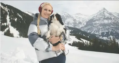  ?? DAVID SCOTT HOLLOWAY ?? Olympian and World Cup skiing champion Lindsey Vonn and her dog Lucy — seen here in Grindelwal­d, Switzerlan­d — host The Pack, a new reality-based show streaming on Amazon Prime Video that features dogs and their owners taking on challenges around the world.