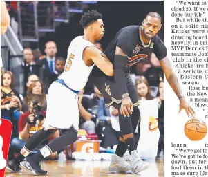  ??  ?? LeBron James (right) of the Cleveland Cavaliers handles the ball against Courtney Lee of the New York Knicks in the first quarter at Quicken Loans Arena in Cleveland, Ohio. — AFP photo