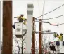  ?? ?? Hearst Connecticu­t Media file photo Eversource Energy workers demonstrat­e power restoratio­n steps. Eversource and United Illuminati­ng told the state their prices for electric generation, passed along to most customers, would double starting Jan. 1.