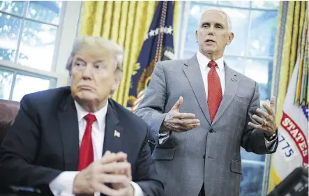  ?? MANDEL NGAN/GETTY IMAGES ?? U.S. Vice-President Mike Pence, right, has denied writing a contentiou­s op-ed in The New York Times that labelled President Donald Trump as incompeten­t and impetuous.