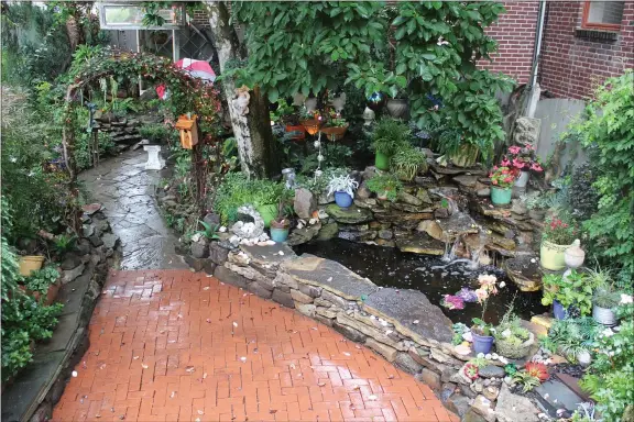  ?? MEDIANEWS GROUP FILE PHOTO ?? A Pottstown residence includes an expansive home garden with many different features including a pond. The 8th Annual Home Garden Contest has two new categories including an “Outdoor Oasis” category.