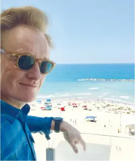  ?? (Twitter) ?? CONAN O’BRIEN looks out over a Tel Aviv beach on Saturday.