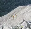  ?? PHOTO: ODT FILES ?? Operationa­l boost . . . Geologists on the slope of a rejuvenati­on area at Bathurst Resources’ Cascade mine operation on the Denniston Plateau, above Westport on the West Coast.