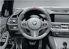  ??  ?? The sporty steering wheel is from the M Performanc­e parts division.