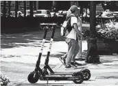  ?? JOHN BAZEMORE/AP ?? Atlanta is banning electric scooters during nighttime hours during what has been a deadly summer for riders.