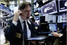  ?? RICHARD DREW — THE ASSOCIATED PRESS ?? Trader Joseph Chirico works on the floor of the New York Stock Exchange, Wednesday.