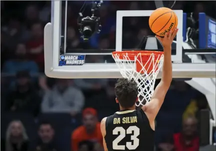  ?? PHOTOS BY AARON DOSTER — THE ASSOCIATED PRESS ?? Colorado forward Tristan da Silva (23) shoots during the first half of a First Four game in the NCAA men’s college basketball tournament against Boise State on Wednesday in Dayton, Ohio.