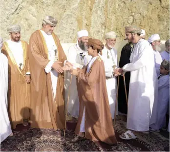  ?? ?? Mahmoud bin Yahya bin Sulaiman al Thuhli, Governor of Al Sharqiyah North, exchanges greetings with citizens after Eid prayers in Ibra on Wednesday.