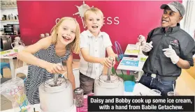  ??  ?? Daisy and Bobby cook up some ice cream, with a hand from Babile Getachew.