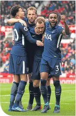  ??  ?? Scorer Christian Eriksen is mobbed