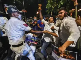  ?? — PTI ?? Youth Congress activists participat­e in a torch procession during a protest against farmers' bills in New Delhi on Thursday.