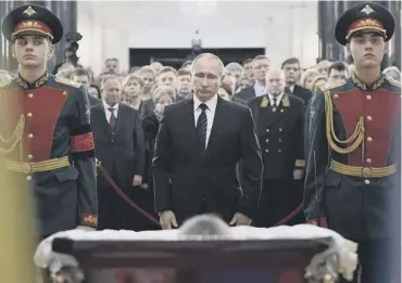  ??  ?? 0 Russian president Vladimir Putin at the lying in state of murdered ambassador Andrei Karlov