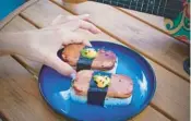  ?? GARRETT HOSPITALIT­Y GROUP ?? Spam musubi is one of Point Break’s so-called “endless summer” appetizers.