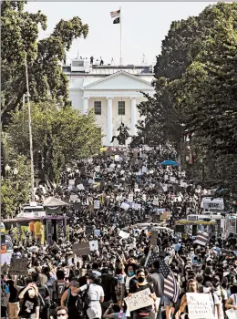  ?? SAMUEL CORUM/GETTY ?? Protesters stretch for blocks during demonstrat­ions Saturday near the White House.