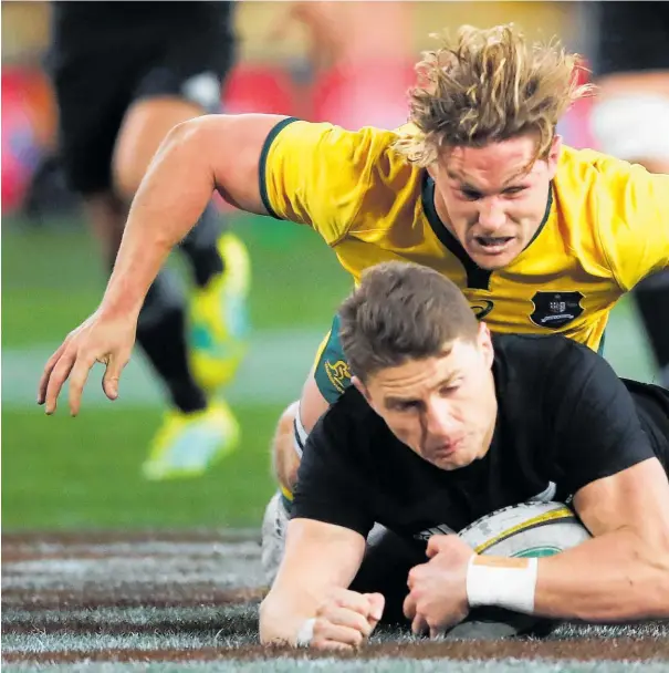  ??  ?? Despite their best efforts, Michael Hooper and the Wallabies struggled to contain Beauden Barrett and the All Blacks last night.