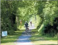  ?? CHARLES PRITCHARD — ONEIDA DAILY DISPATCH ?? Bikers make their way down the trail during the Ride the Erie Bike Tour on July 12, 2018.