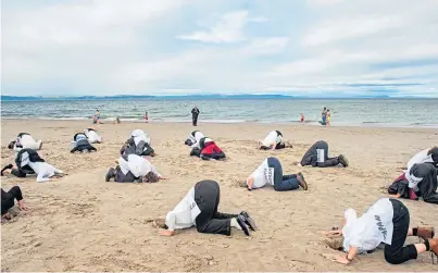  ?? Photograph by Jason Hedges ?? MOVEMENT: Climate campaigner­s call on leaders to pull their heads out of the sand.