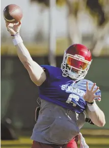  ?? AP PHOTO ?? FUTURE’S SO BRIGHT . . . Oklahoma quarterbac­k Baker Mayfield participat­es in drills during a short segment of Rose Bowl practice on Friday in Carson, Calif.