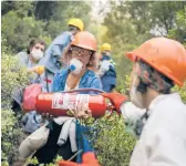  ?? EMRE TAZEGUL/AP ?? Turkish volunteers head to fight wildfires Wednesday in Turgut village, near the tourist resort of Marmaris, Mugla, Turkey. The fires have killed eight people.
