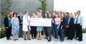  ??  ?? The Portervill­e Breakfast Rotary and SVMC employees raised total of $35,254.96 donation for the Roger S. Good Cancer Center.