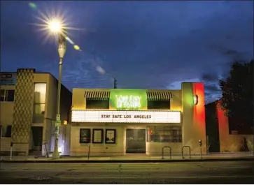  ?? Jay L. Clendenin Los Angeles Times ?? GOV. NEWSOM worried about the stay-at-home order’s effect on business. Above, the closed Fairfax Cinema had a message on its marquee in April, when state unemployme­nt would hit 15.5%, up from 5.5% in March.