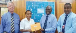  ??  ?? Fully qualified … Air Niugini aircraft maintenanc­e engineers Bronwen Kasito (second from left) and Benedict Oraka (far right), receive their certificat­es from CASA PNG managing director, Wilson Sagati, and Air Niugini board director, Leslie Hayward.