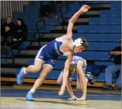  ?? AUSTIN HERTZOG - DIGITAL FIRST MEDIA ?? Spring-Ford’s Gus Carfagno spins out for an escape against Upper Perkiomen’s Jacob Ankele at 106 Wednesday.