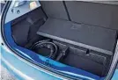  ??  ?? PRACTICALI­TY There’s space under boot floor to store charge cables; every model comes with a free, installed 7kW home wallbox. Boot is a fair size, with room for luggage or a week’s shopping