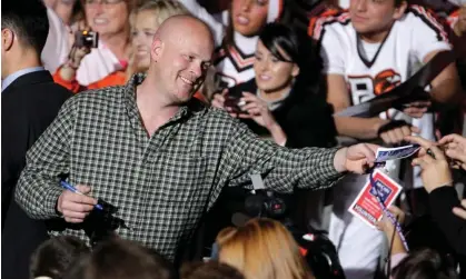  ?? Photograph: Amy Sancetta/AP ?? Samuel Joseph Wurzelbach­er, known as ‘Joe the Plumber’, signs autographs in Ohio in October 2008.