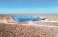  ?? EDDIE MOORE|ALBUQUERQU­E JOURNAL ?? Wastewater from drilling wells in the Permian Basin is stored in ponds like this one southeast of Carlsbad. A water reuse proposal from the New Mexico Environmen­t Department would allow produced water from oil and gas extraction and treated domestic wastewater to be more widely applied, in strictly limited circumstan­ces.