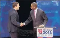  ?? CARLINE JEAN/TNS ?? Florida gubernator­ial candidates Rep. Ron DeSantis, left, and Tallahasse­e Mayor Andrew Gillum during a debate at Broward College.