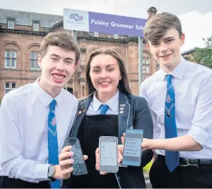  ??  ?? Keeping up to date Paisley Grammar School students Joshua Campbell, Holly Hamilton and Ross Allan received their exam results on their phones.