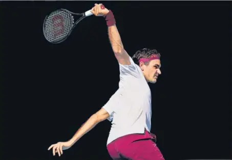  ?? GETTY IMAGES ?? Roger Federer produces a patent backhand during his quarter-final victory over American Tennys Sandgren at the Australian Open on Tuesday.
■