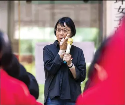  ?? PROVIDED TO CHINA DAILY ?? Zhang Guimei, founder and principal of Huaping High School for Girls in Huaping county in Southwest China’s Yunnan province, often has her aching fingers banded to ease pain.