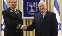  ?? (Mark Neyman/GPO) ?? ARMENIAN AMBASSADOR to Israel Armen Smbatyan (top right) presents credential­s to President Reuven Rivlin (Hillel Maeir/ TPS). Anatoly Victorov (bottom left), ambassador of Russia, poses with the president.