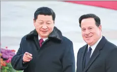  ?? FENG YONGBIN / CHINA DAILY ?? President Xi Jinping and Panamanian President Juan Carlos Varela walk together during a welcoming ceremony at the Great Hall of the People in Beijing on Friday.