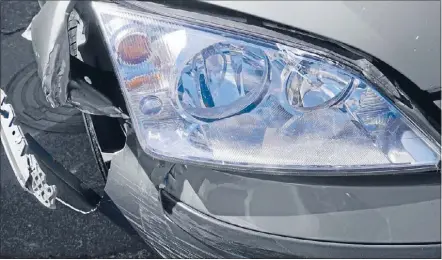  ??  ?? Insurance claim: A damaged headlight, which a crash repairer will receive $17 for replacing, down from $22.