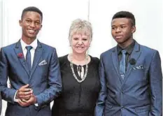  ?? Picture: SUPPLIED ?? SPECIAL MOMENT: Mariette Visser, pictured with grade 12 pupils Mvelontle Gwama, left, and Mvuyelwa Gali, at the Get Ahead College matric dance in 2019