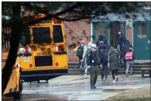  ?? AP/ALEX BRANDON ?? Police escort students Tuesday after a shooting at Great Mills High School in Great Mills, Md.