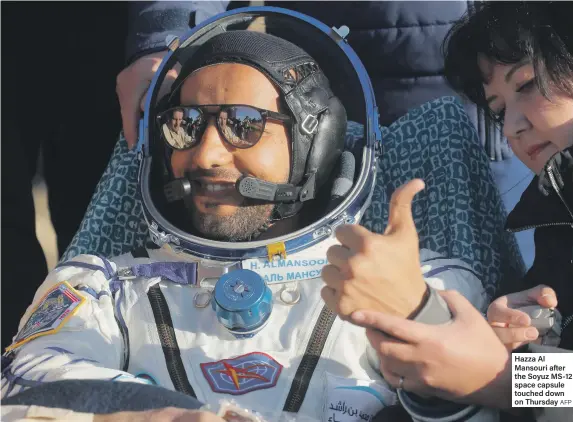  ?? AFP ?? Hazza Al Mansouri after the Soyuz MS-12 space capsule touched down on Thursday