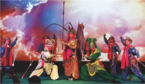  ?? Atiq Ur Rehman/Gulf News ?? Above: The acclaimed Chinese National Peking Opera Company staging a performanc­e.Right: The Chinese community dressed in traditiona­l attire during National Day celebratio­ns in Dubai on Sunday.