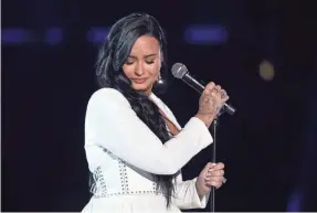  ?? MATT SAYLES/INVISION/AP ?? Demi Lovato debuted her emotional ballad “Anyone” at the Grammys last year. She recorded it just four days before her 2018 overdose.