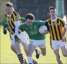  ??  ?? Walter Walsh tackles Aodhán Doyle of Naomh Eanna.